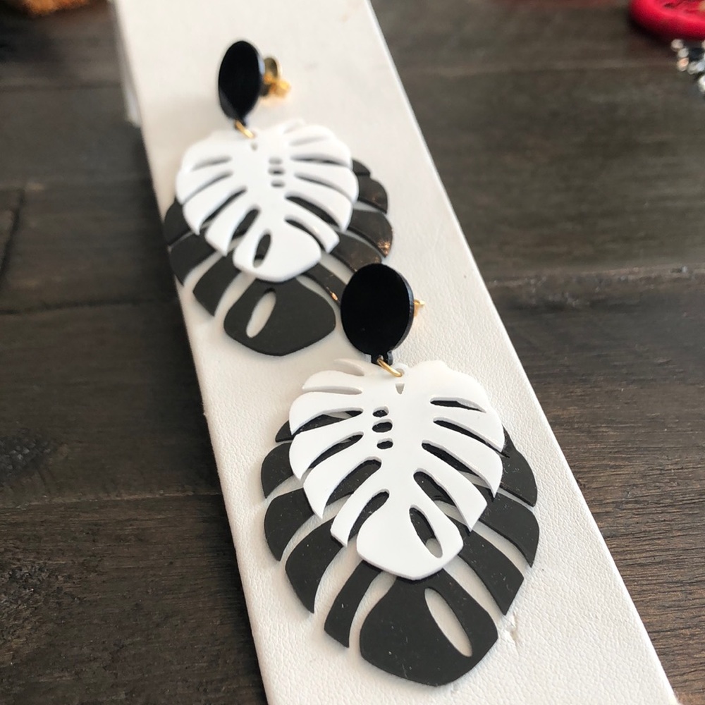 These palm leaf inspired earrings are show stoppers! Black and white acrylic.